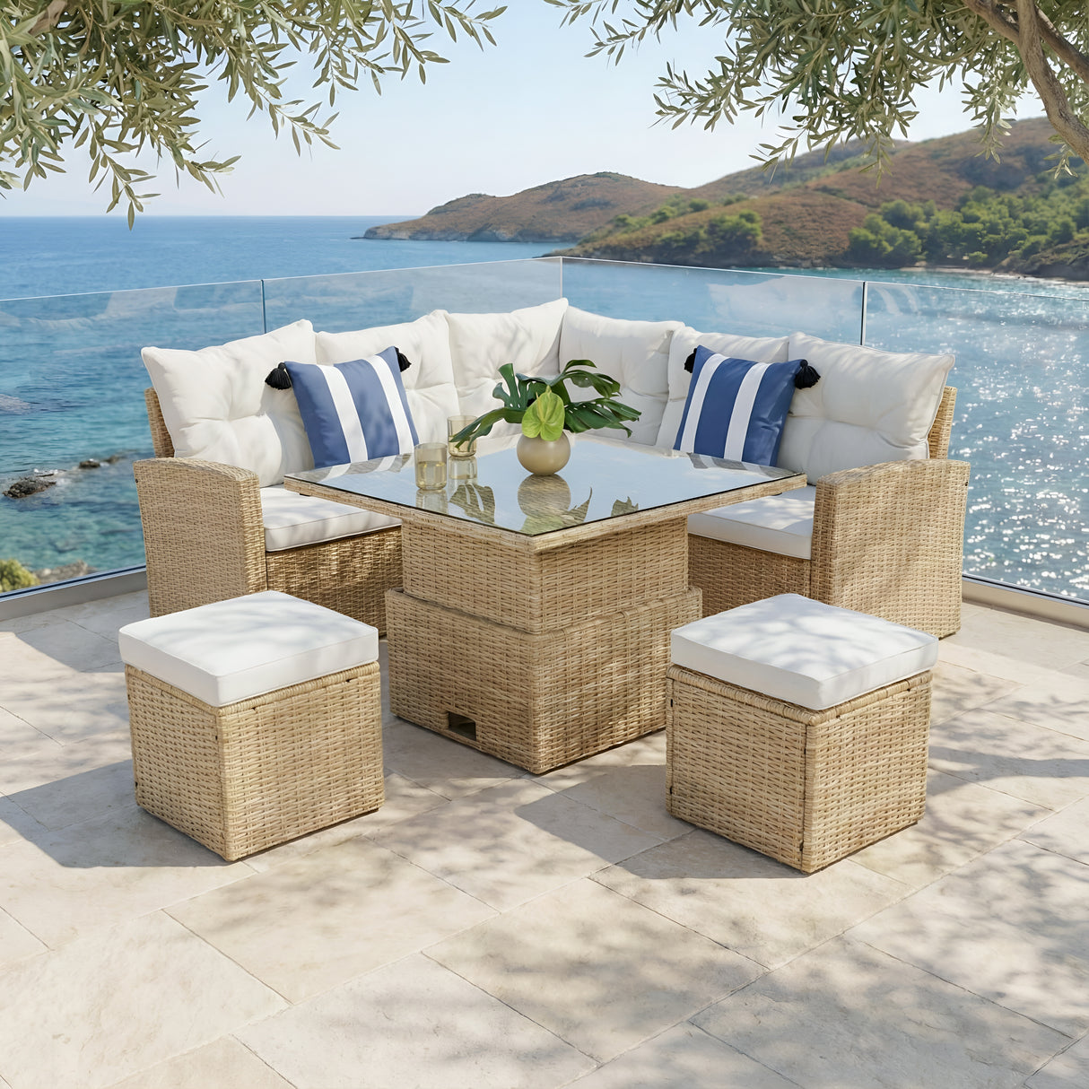 Outdoor patio furniture set with cushions by a scenic ocean view.