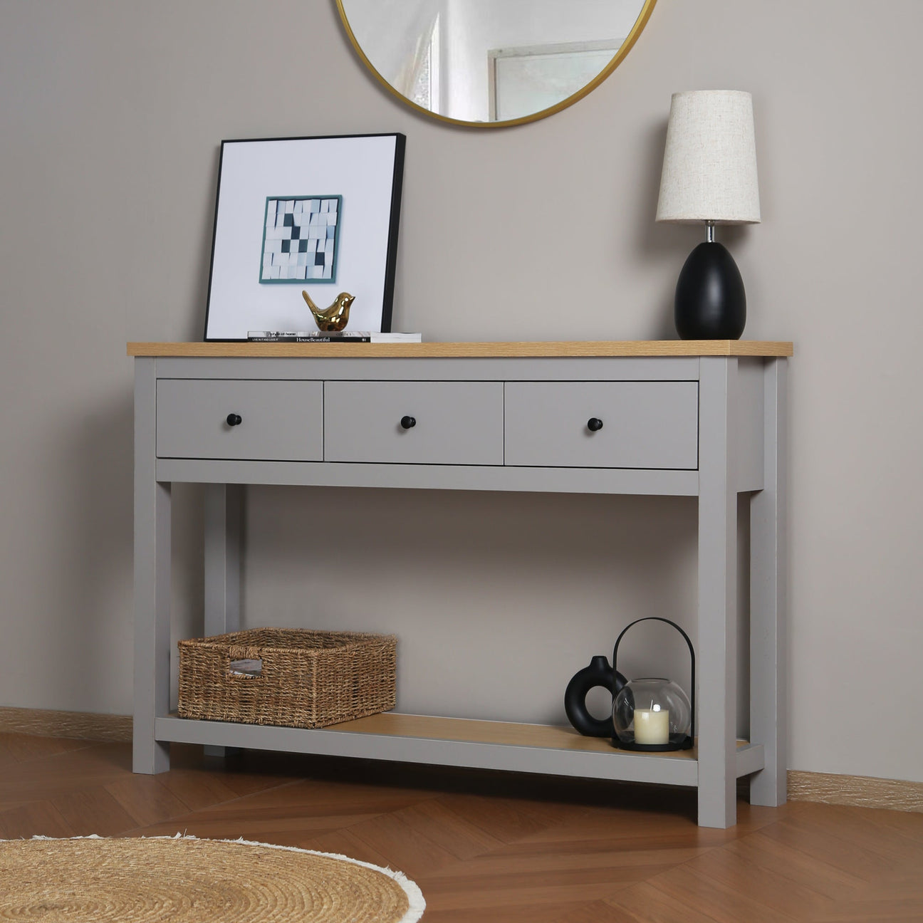 Grey Wiltshire console table styled with a mirror, lamp and decorative accessories