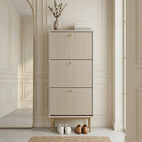 Grey Devon Shoe Cabinet with three fluted compartments, gold handles and slim gold legs, styled in a modern hallway.