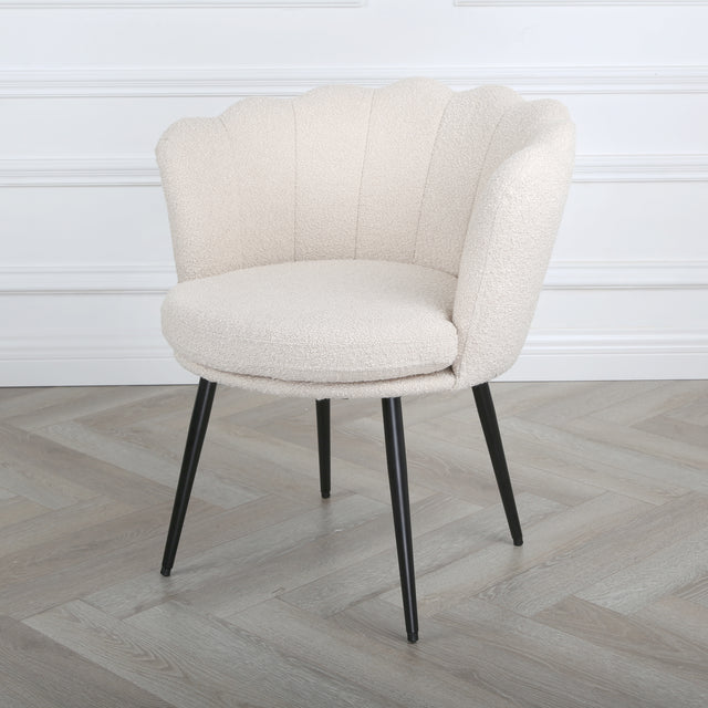 Flora cream boucle armchair with black legs, angled room view