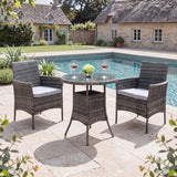 Outdoor patio set with table and chairs by a pool