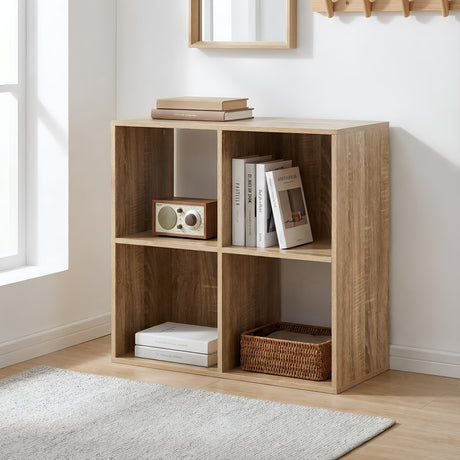 Wooden bookshelf with books, a radio, and a basket in a room with a window and rug.