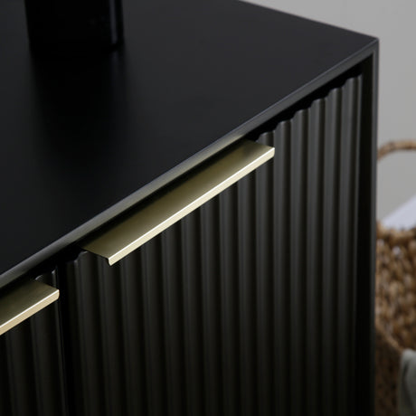 Close up of the black Monza sideboard showing the gold handles and fluted door panels.