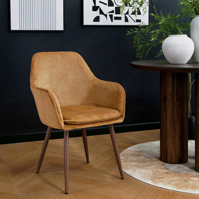 Orange Muse Woven Yarn Accent Armchair styled in a dark dining room