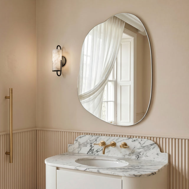 Nemi Frameless Irregular Pond Wall Mirror styled above a marble bathroom vanity