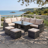 Outdoor patio set with cushions on a stone patio overlooking a scenic landscape.